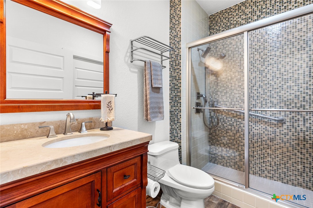 130 Sobrante Road, Unit 112 Belton, TX 76513 - Photo 27 of 48 a bathroom with a sink a toilet and shower