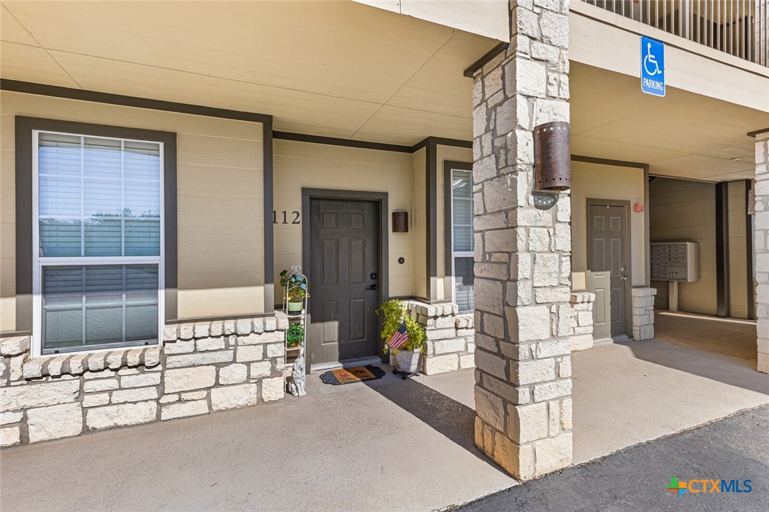 130 Sobrante Road, Unit 112 Belton, TX 76513 - Photo 4 of 48 front view of a house with a glass door