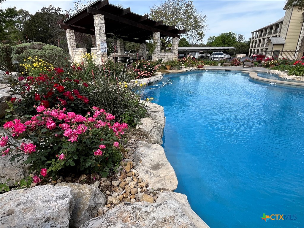 130 Sobrante Road, Unit 112 Belton, TX 76513 - Photo 46 of 48 a view of a lake with sitting area
