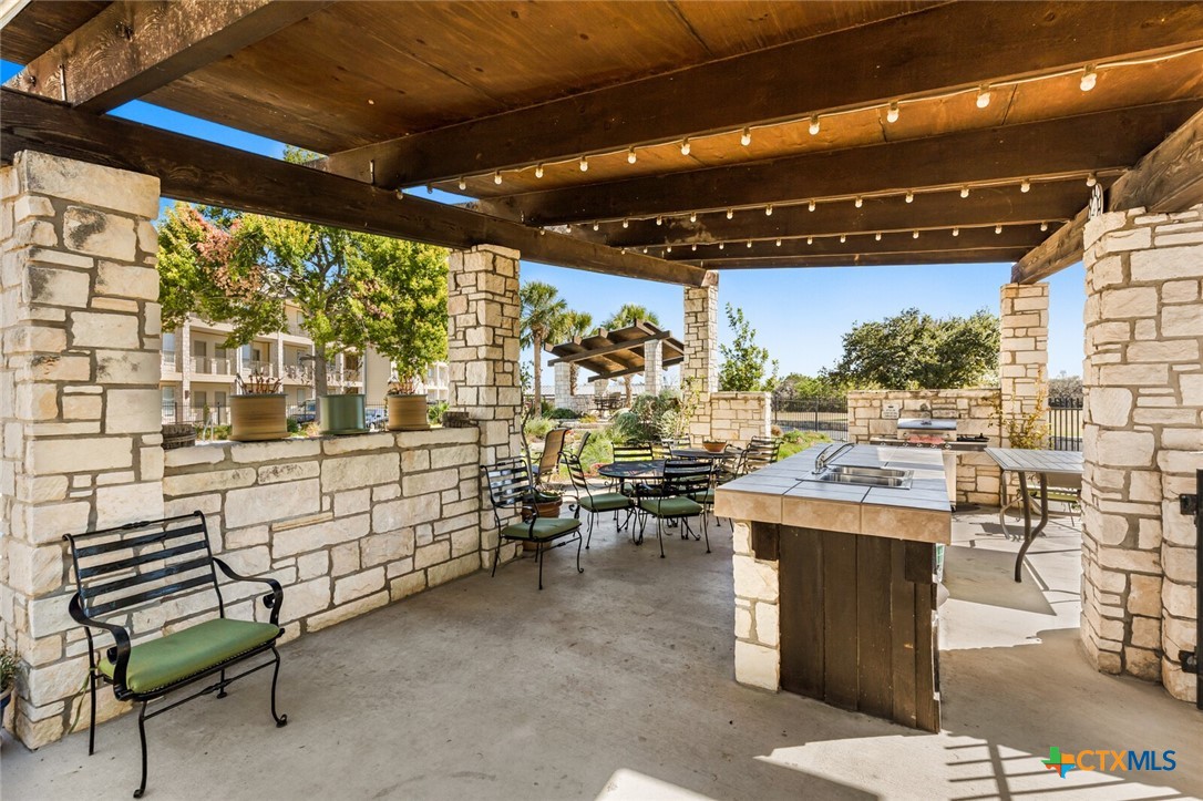 130 Sobrante Road, Unit 112 Belton, TX 76513 - Photo 48 of 48 a room with lots of wooden furniture and a table