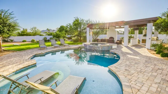 swimming pool view with a outdoor seating space