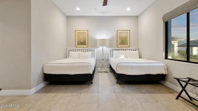 a bedroom with bed and window