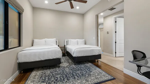 a bedroom with bed and a couch