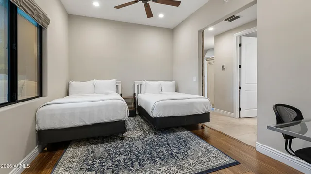 a bedroom with bed and a couch