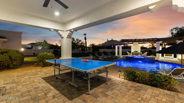 a living room with furniture a rug and a table