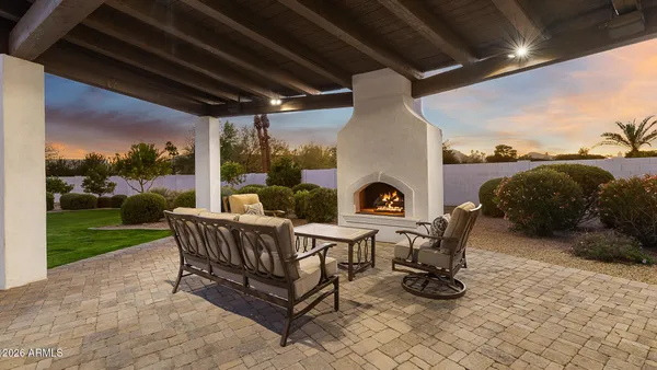 a view of a porch with furniture and yard