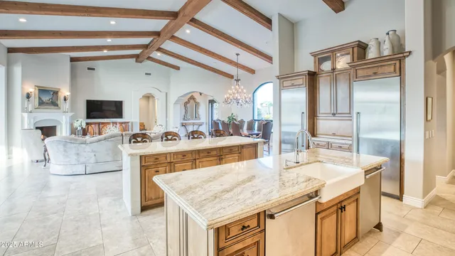 a bathroom with a granite countertop sink a mirror and vanity