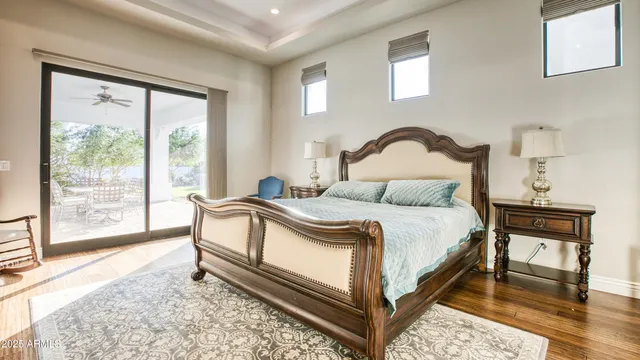 a bedroom with a bed and a window with the outer view
