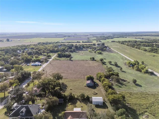 an aerial view of a city with ocean view