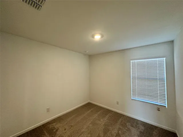 a bathroom with a shower and a sink