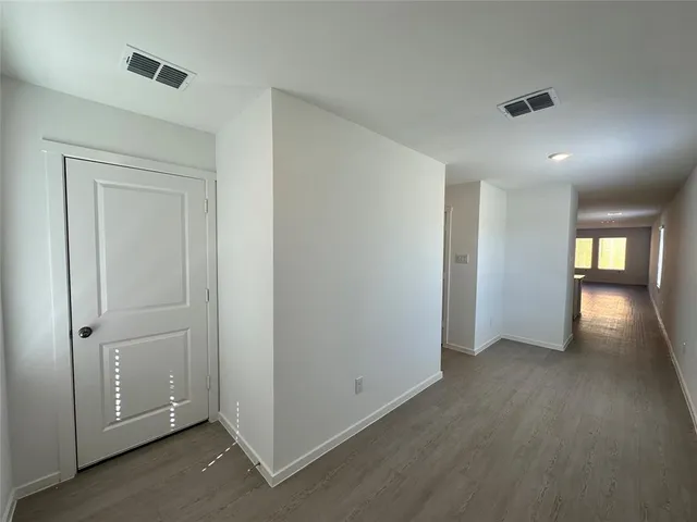 an empty room with a empty space and window