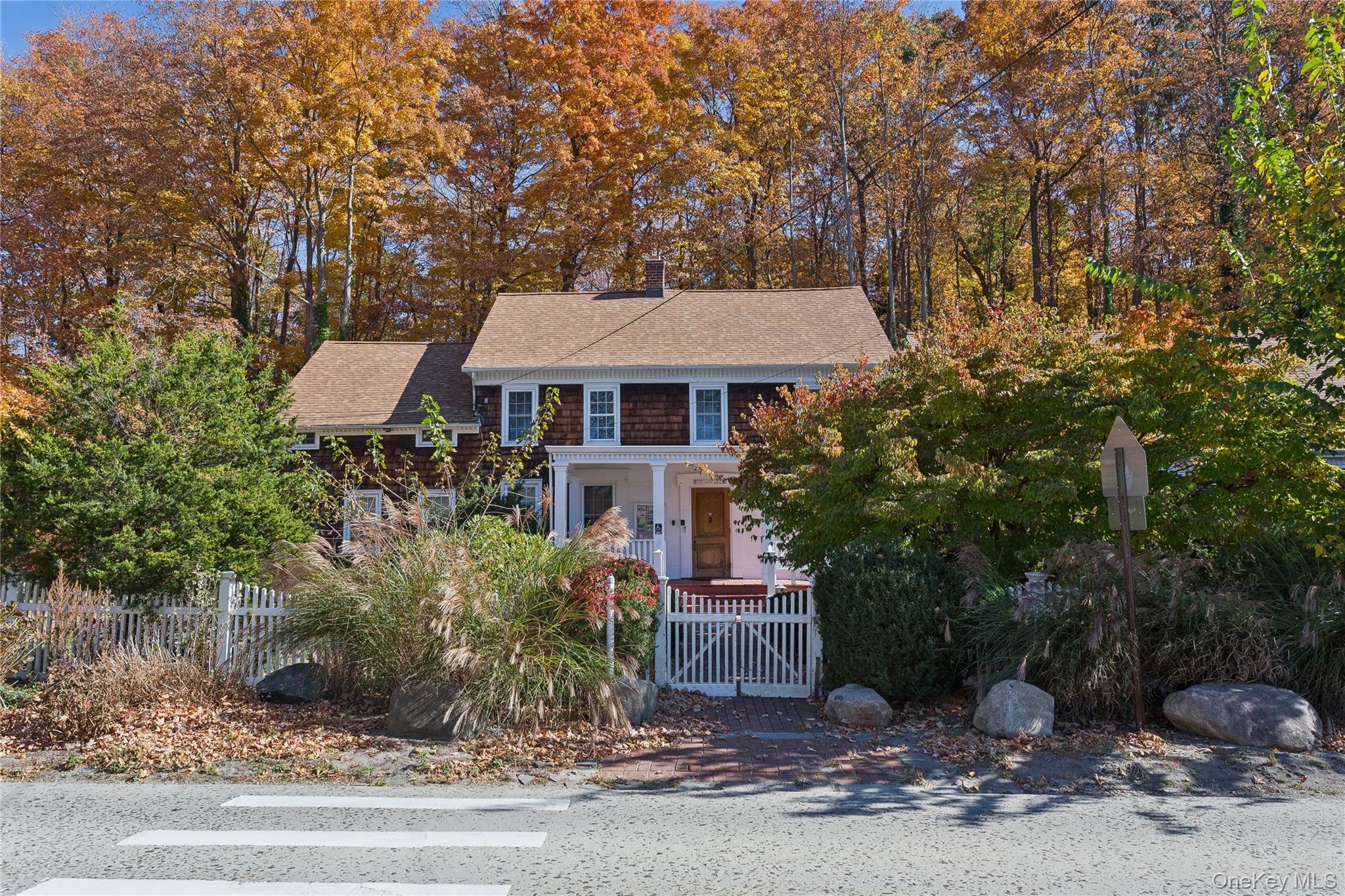 58 Goose Hill Road Cold Spring Harbor, NY 11724 - Photo 3 of 32 a front view of a house with a yard and tree s