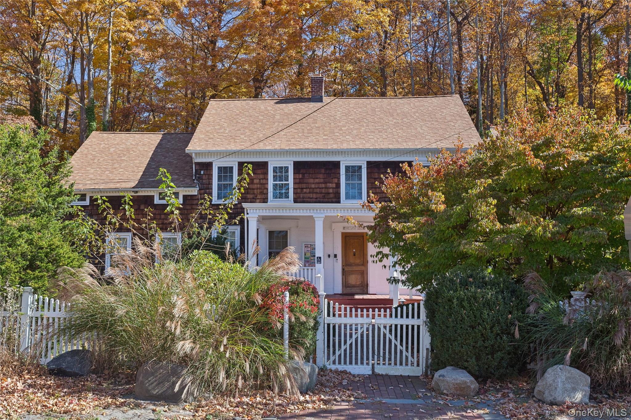 58 Goose Hill Road Cold Spring Harbor, NY 11724 - Photo 4 of 32 front view of a house with a yard