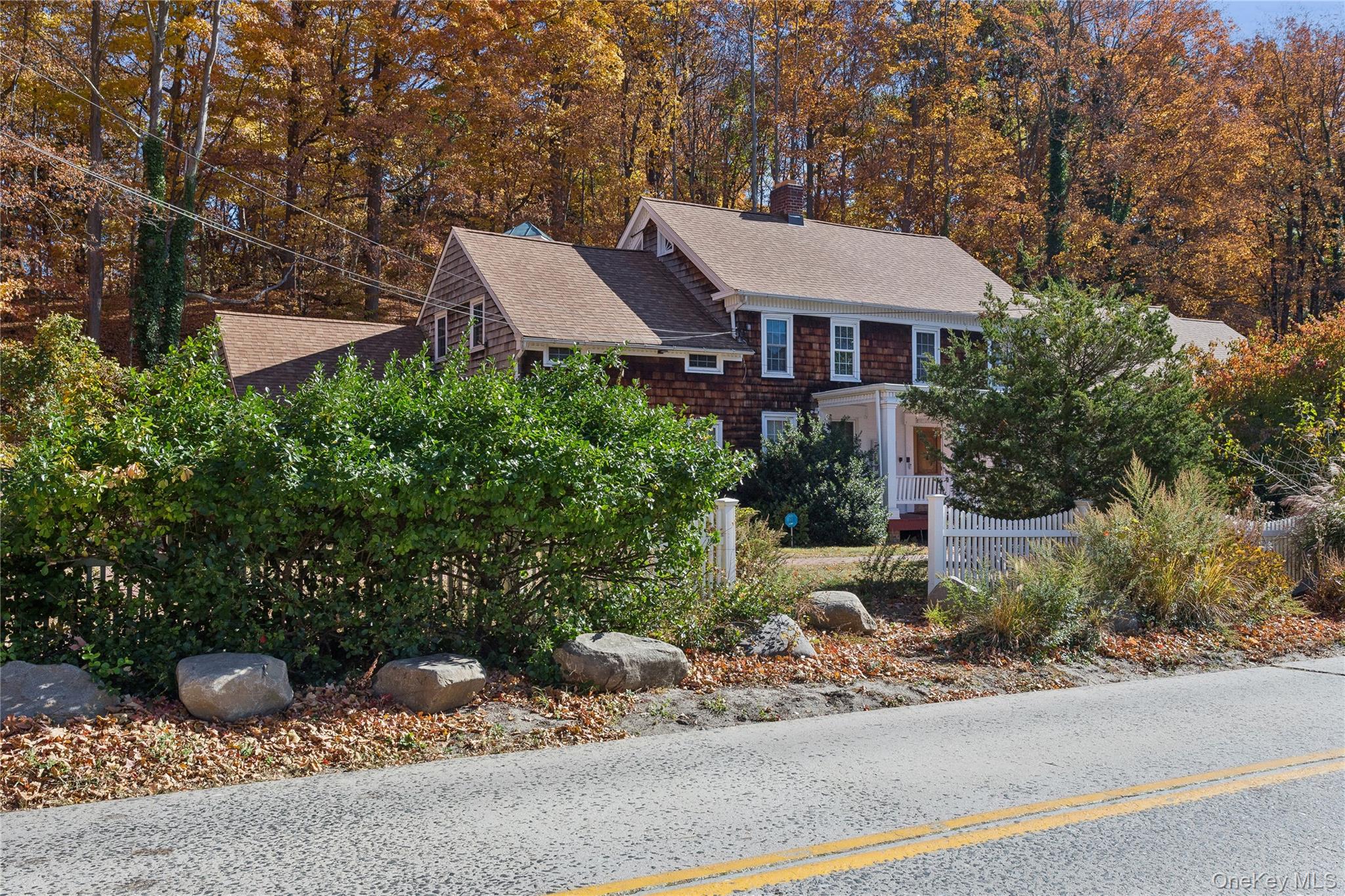 58 Goose Hill Road Cold Spring Harbor, NY 11724 - Photo 5 of 32 a view of a house with a yard and sitting area