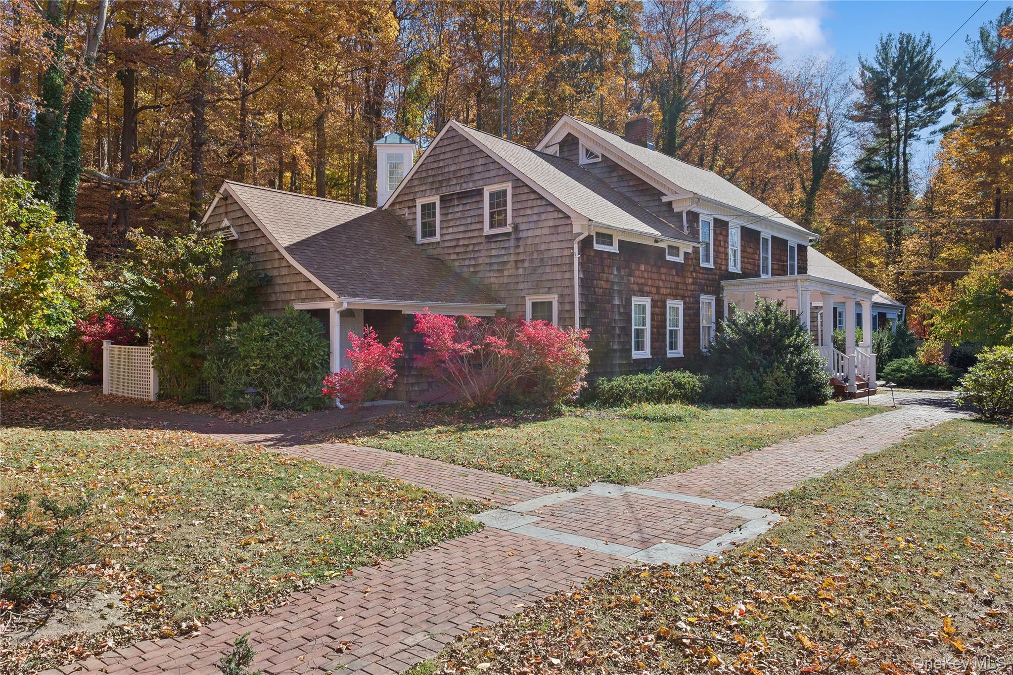58 Goose Hill Road Cold Spring Harbor, NY 11724 - Photo 6 of 32 a front view of a house with garden