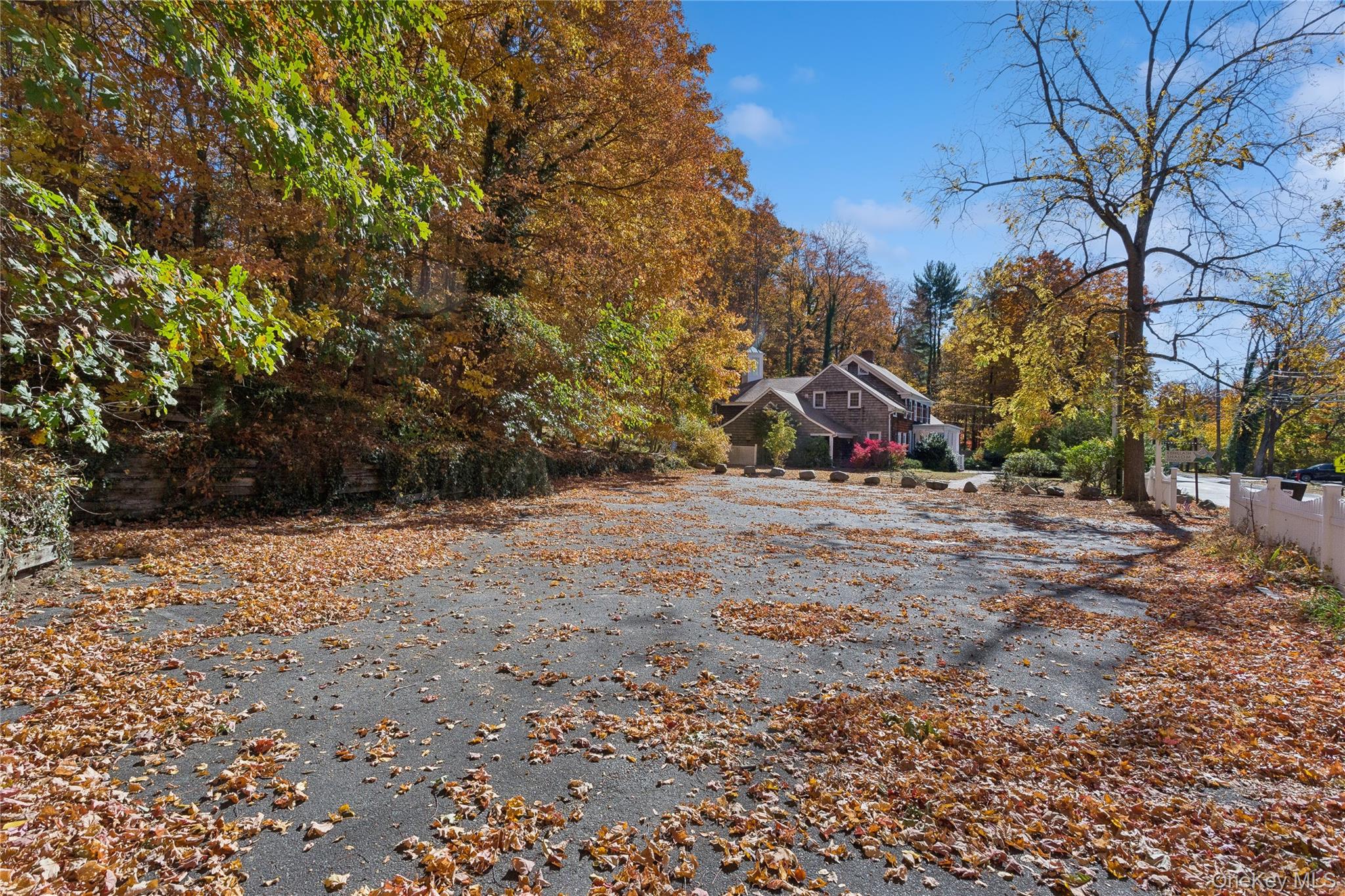 58 Goose Hill Road Cold Spring Harbor, NY 11724 - Photo 8 of 32 a view of dirt field with trees in the background