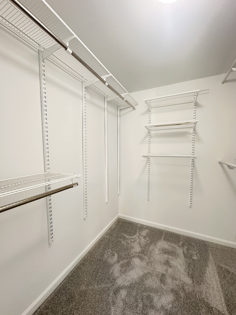 1603 North Windsor Drive, Unit 102 Arlington Heights, IL 60004 - Photo 15 of 18 a view of an empty walk in closet