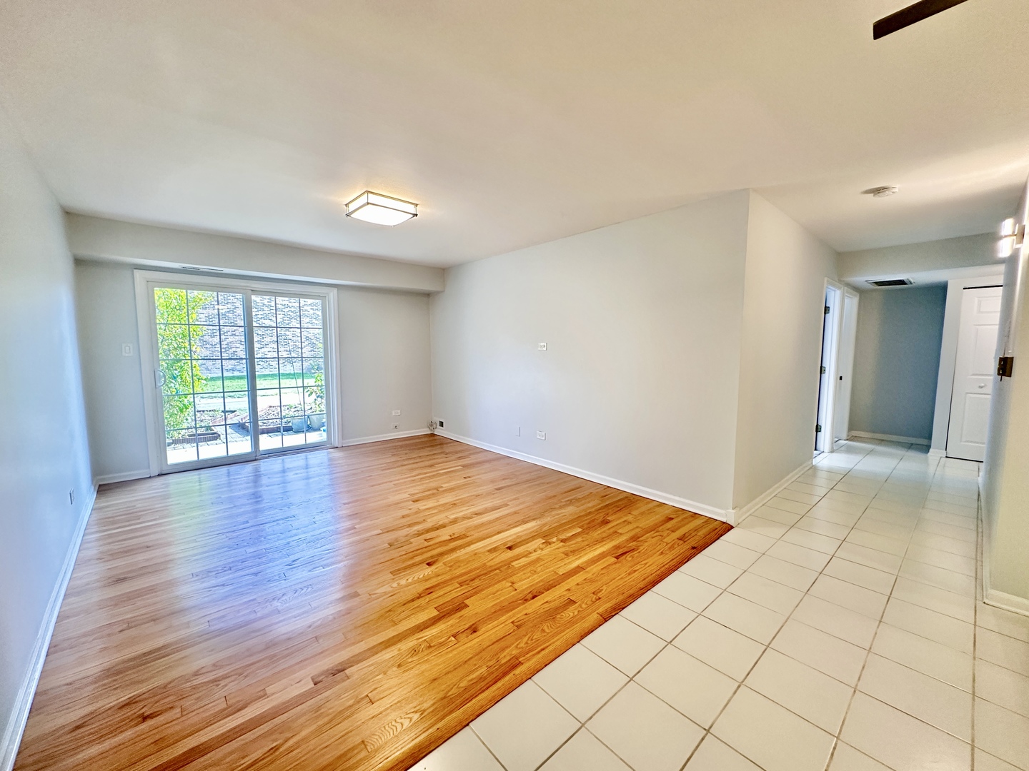 1603 North Windsor Drive, Unit 102 Arlington Heights, IL 60004 - Photo 2 of 18 a view of an empty room and window
