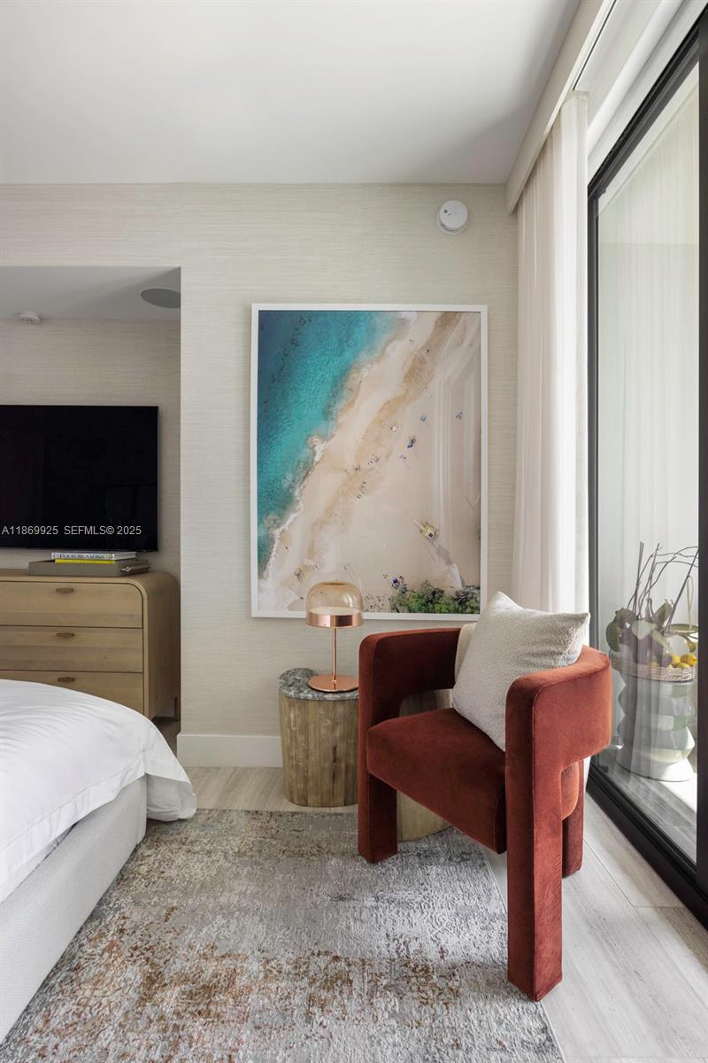 1451 Brickell Avenue, Unit 1901 Miami, FL 33131 - Photo 14 of 31 a living room with furniture and a flat screen tv