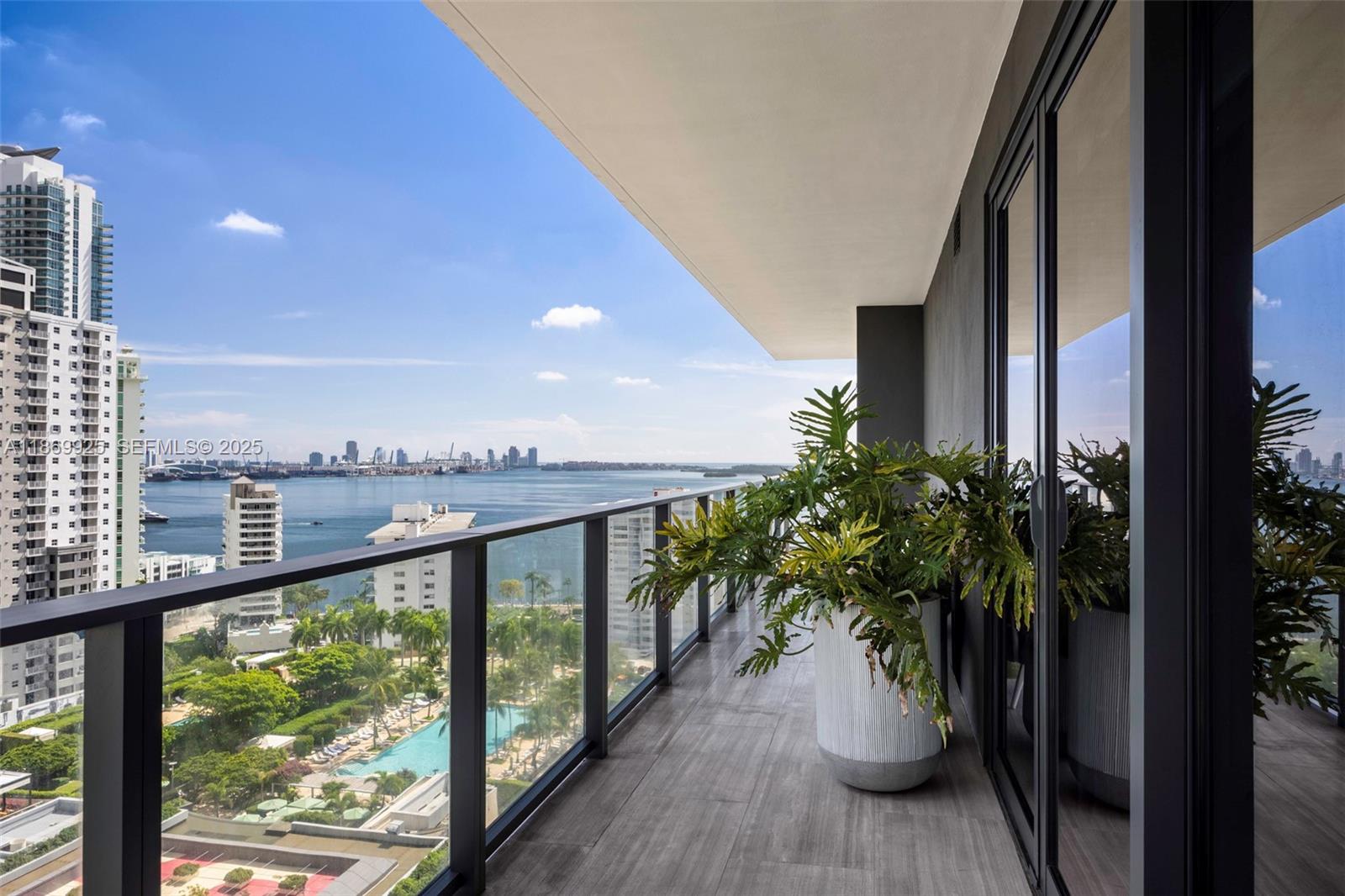 1451 Brickell Avenue, Unit 1901 Miami, FL 33131 - Photo 23 of 31 a view of a balcony with lake view and a potted plant