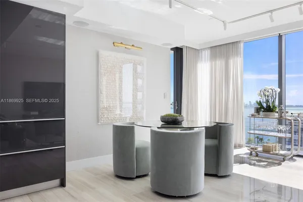 a kitchen with stainless steel appliances granite countertop a refrigerator and a stove