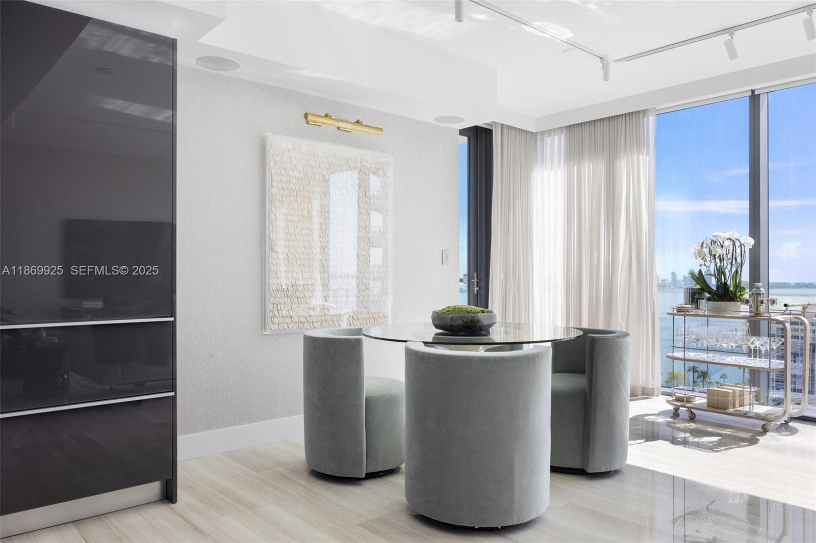 1451 Brickell Avenue, Unit 1901 Miami, FL 33131 - Photo 4 of 31 a kitchen with stainless steel appliances granite countertop a refrigerator and a stove