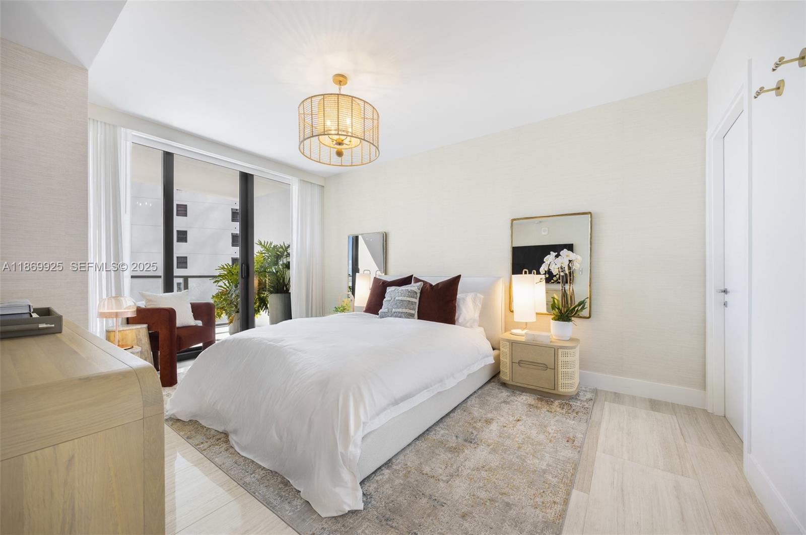 1451 Brickell Avenue, Unit 1901 Miami, FL 33131 - Photo 5 of 31 a bedroom with a bed and window