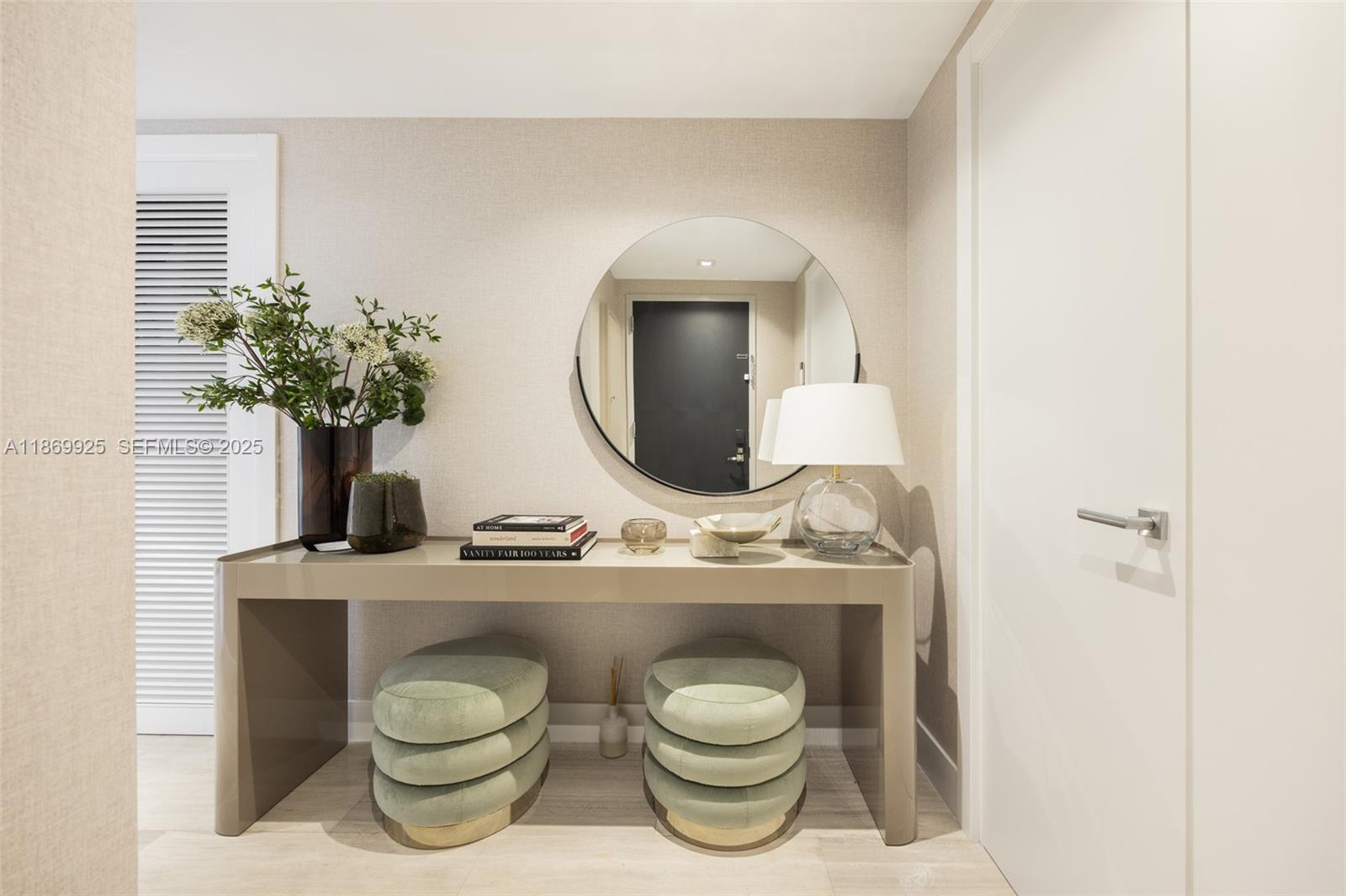 1451 Brickell Avenue, Unit 1901 Miami, FL 33131 - Photo 7 of 31 a bathroom with a toilet a sink and mirror