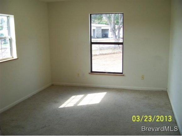 3299 Northeast Jackson Palm Bay, FL 32905 - Photo 6 of 12 an empty room with a window