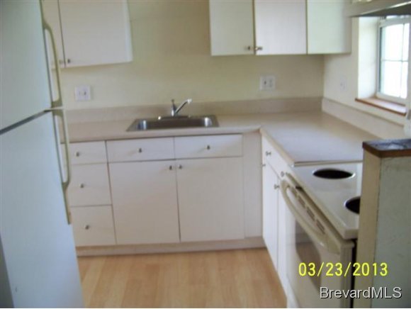 3299 Northeast Jackson Palm Bay, FL 32905 - Photo 8 of 12 a kitchen with a sink and cabinets
