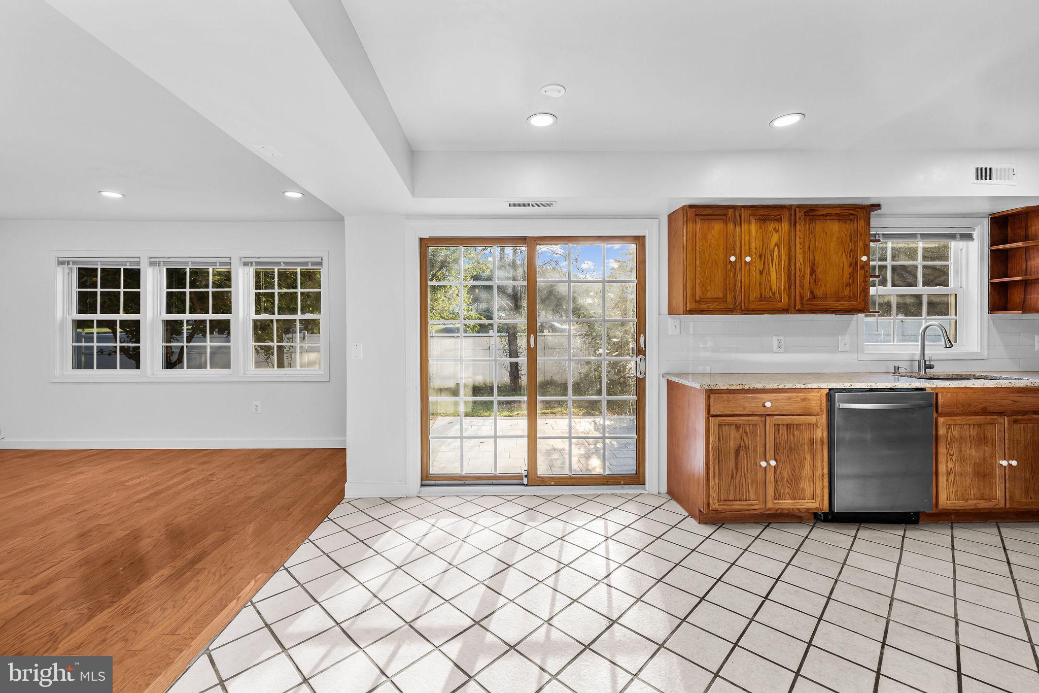 4001 Middle Ridge Drive Fairfax, VA 22033 - Photo 13 of 49 a kitchen with stainless steel appliances granite countertop a stove a sink and a microwave