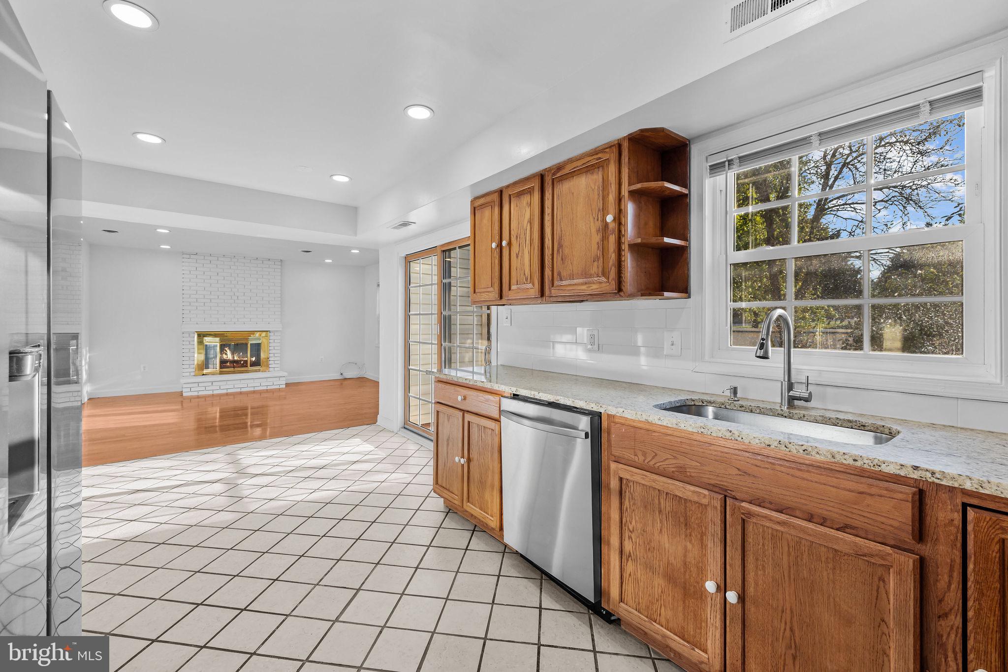 4001 Middle Ridge Drive Fairfax, VA 22033 - Photo 15 of 49 a large kitchen with kitchen island granite countertop a sink and a window