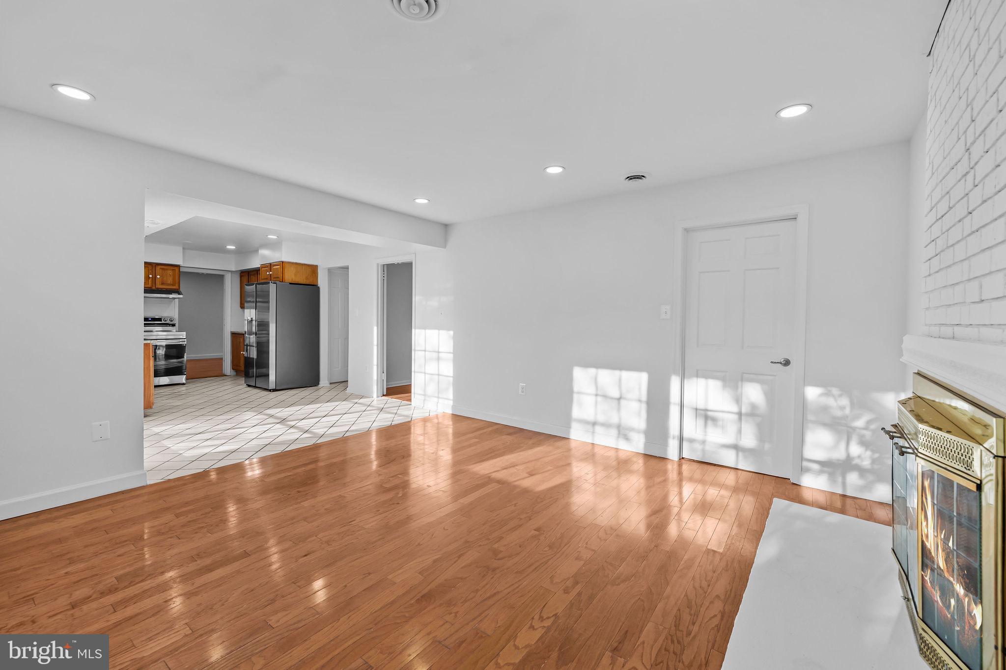 4001 Middle Ridge Drive Fairfax, VA 22033 - Photo 17 of 49 a view of an empty room with wooden floor and a window