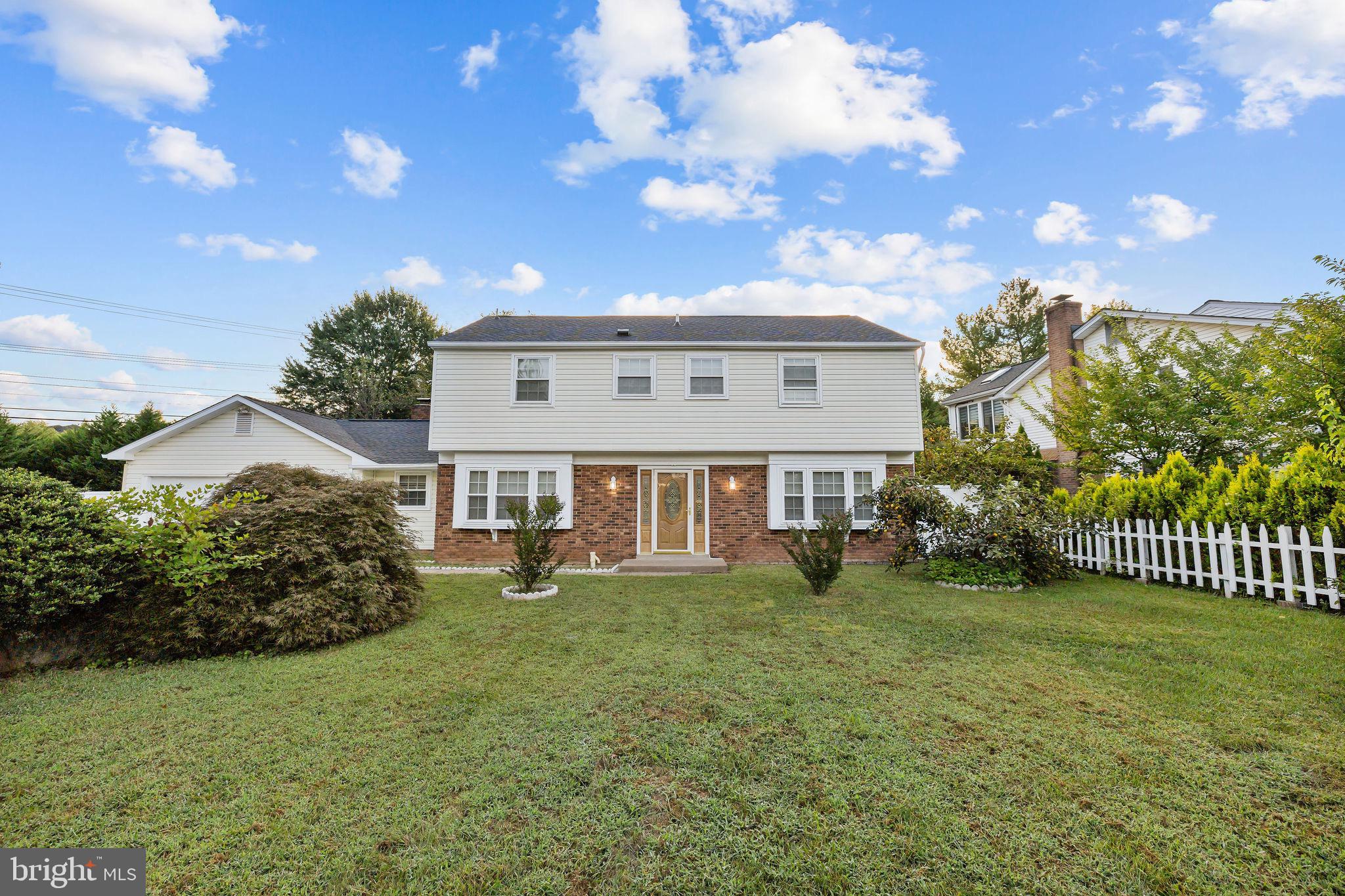 4001 Middle Ridge Drive Fairfax, VA 22033 - Photo 2 of 49 a view of a house with a big yard and large trees