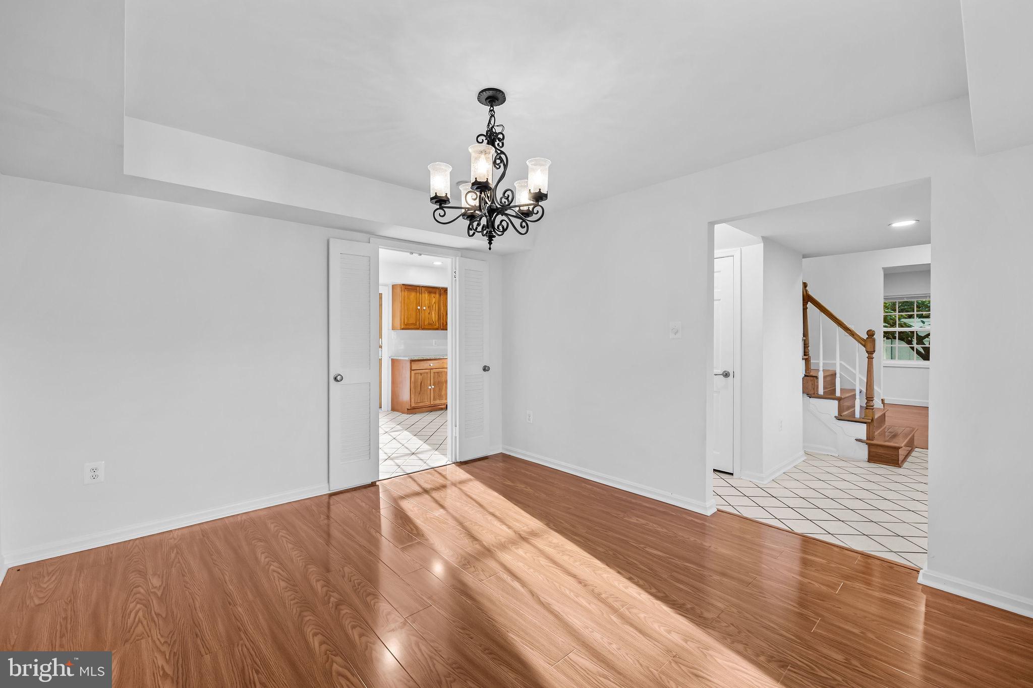 4001 Middle Ridge Drive Fairfax, VA 22033 - Photo 21 of 49 a view of a livingroom with wooden floor and a chandelier