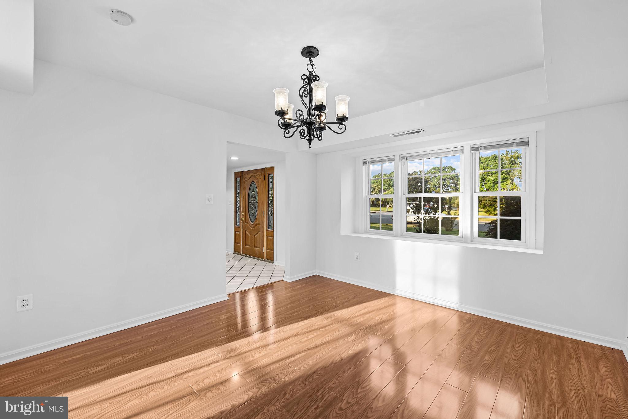 4001 Middle Ridge Drive Fairfax, VA 22033 - Photo 22 of 49 a view of wooden floor and a chandelier in a room