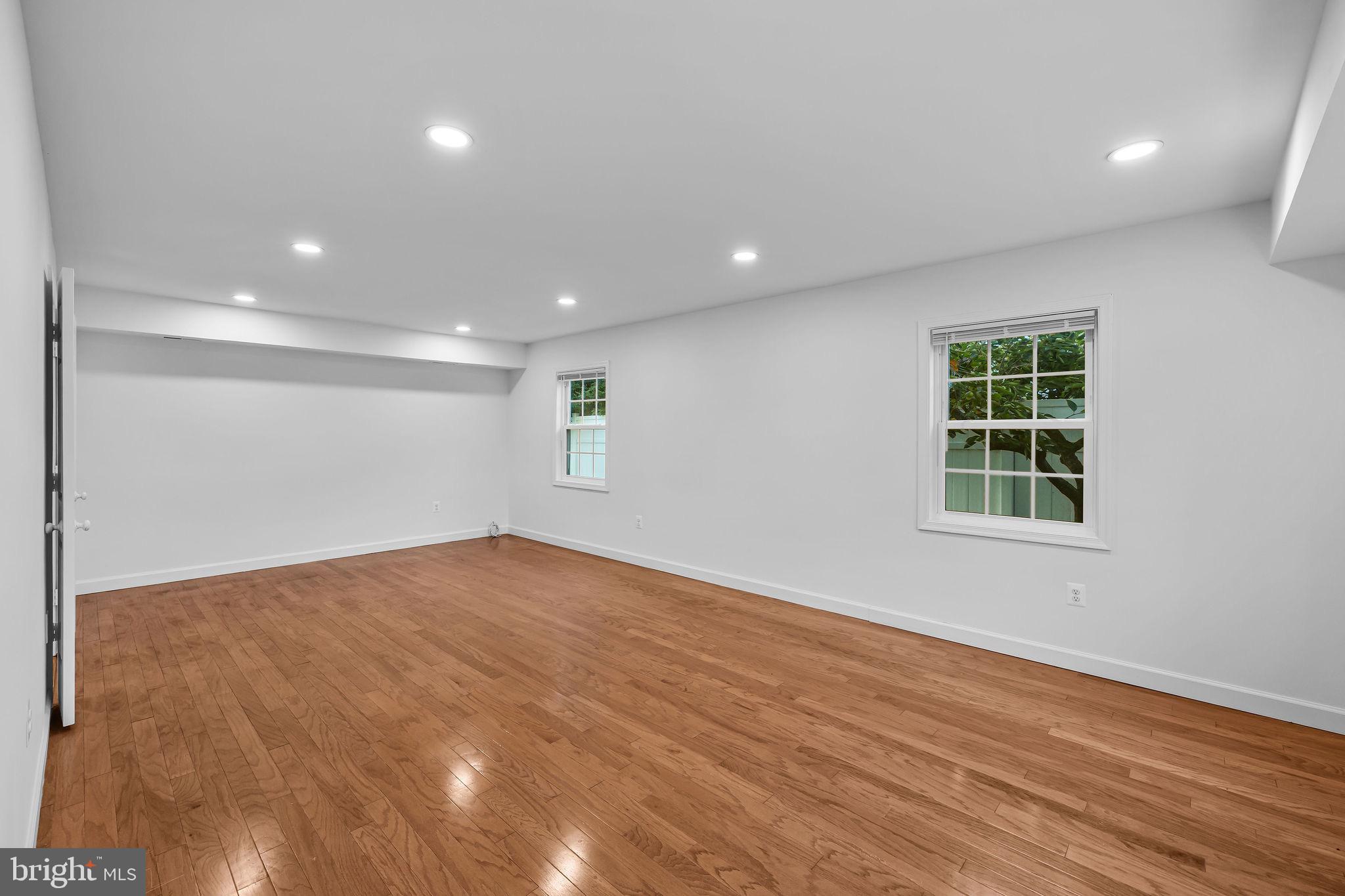 4001 Middle Ridge Drive Fairfax, VA 22033 - Photo 24 of 49 an empty room with wooden floor and windows