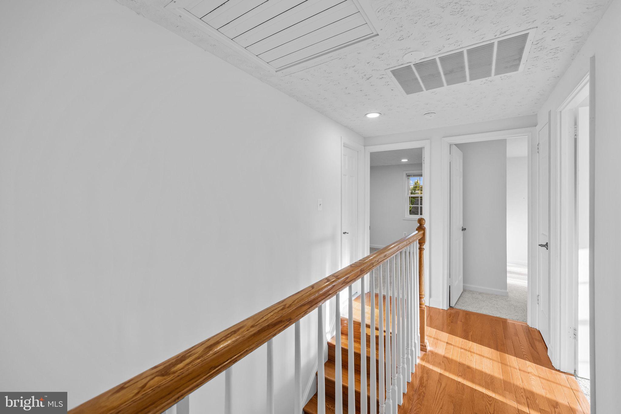 4001 Middle Ridge Drive Fairfax, VA 22033 - Photo 26 of 49 a view of a hallway with wooden floor