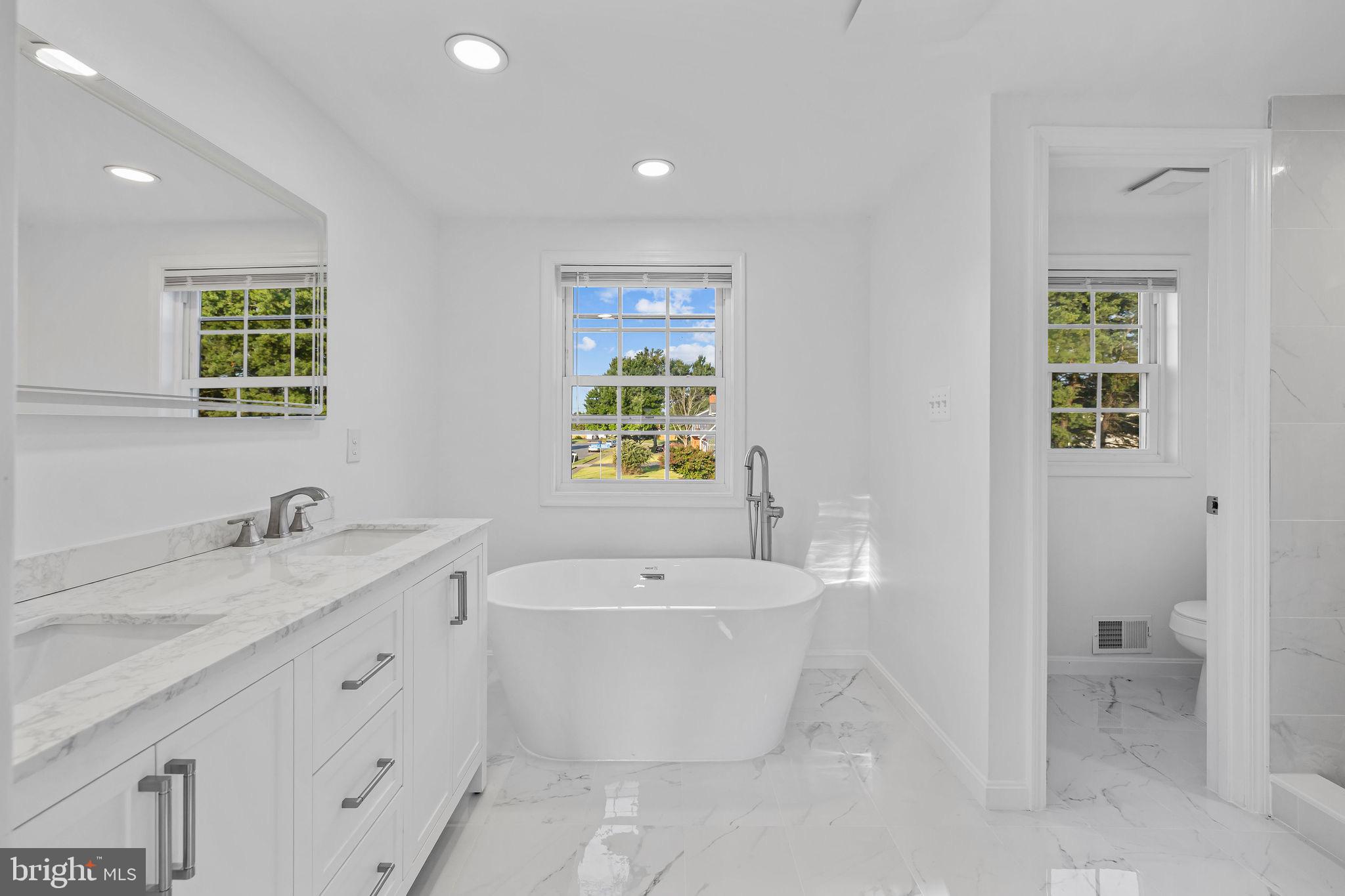 4001 Middle Ridge Drive Fairfax, VA 22033 - Photo 37 of 49 a spacious bathroom with a bathtub sink and toilet