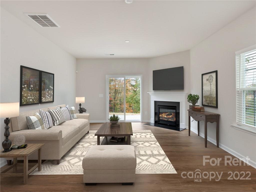 6531 Gopher Road Lancaster, SC 29720 - Photo 5 of 29 a living room with furniture flat screen tv and a fireplace