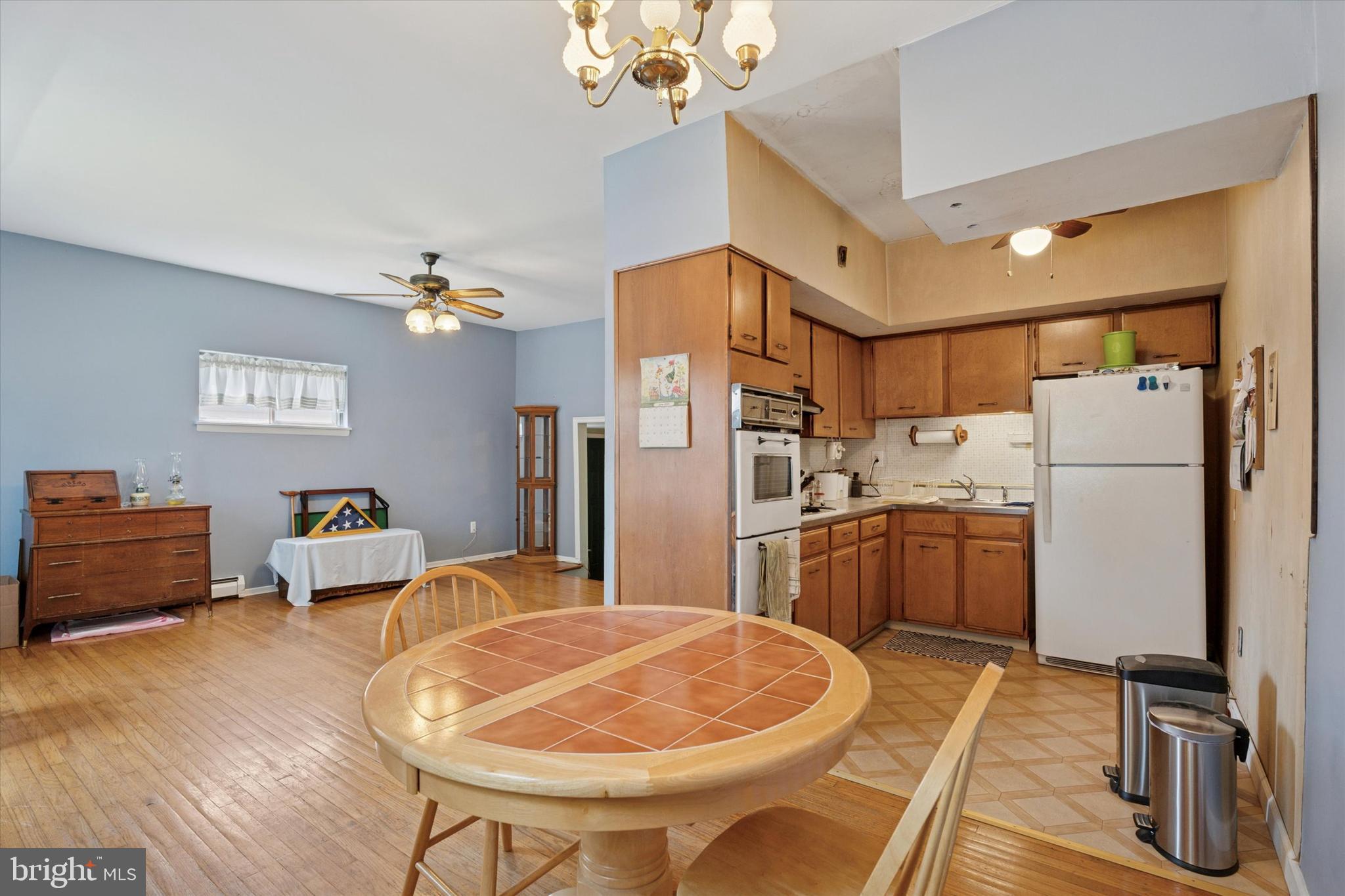 718 Cherry Street Lansdale, PA 19446 - Photo 12 of 23 a bedroom with furniture and a chandelier