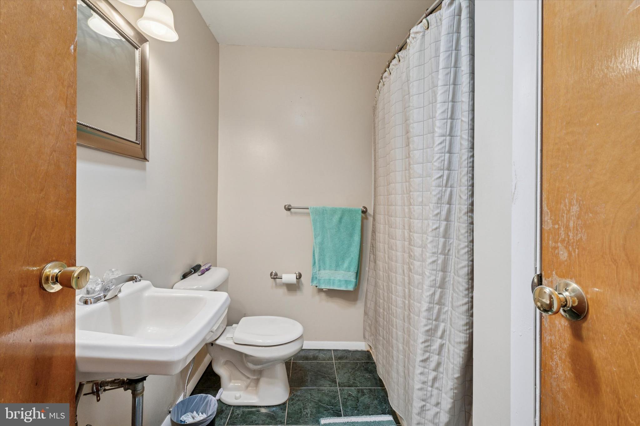 718 Cherry Street Lansdale, PA 19446 - Photo 15 of 23 a bathroom with a sink and toilet