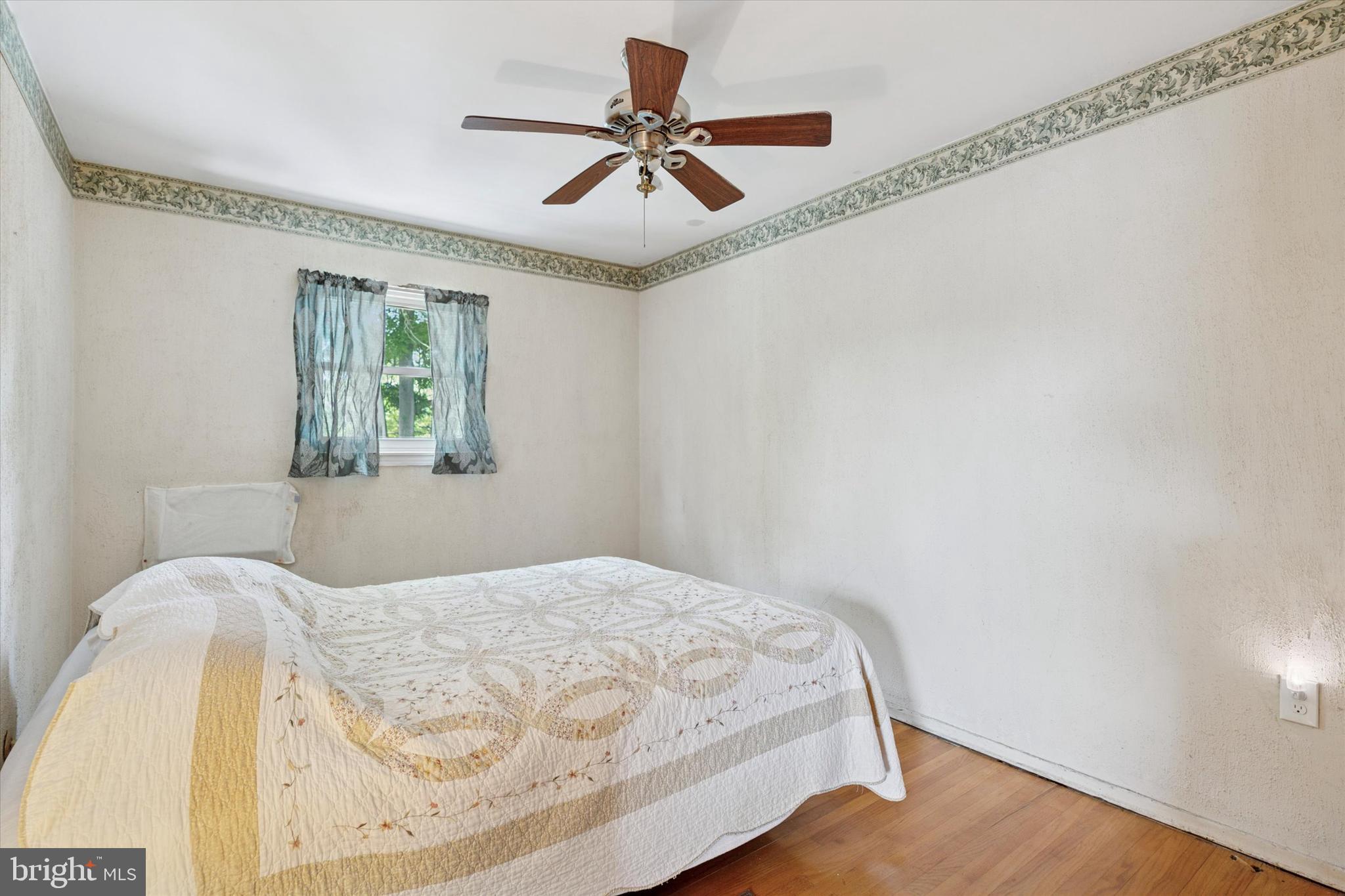 718 Cherry Street Lansdale, PA 19446 - Photo 16 of 23 a bedroom with a bed and a window