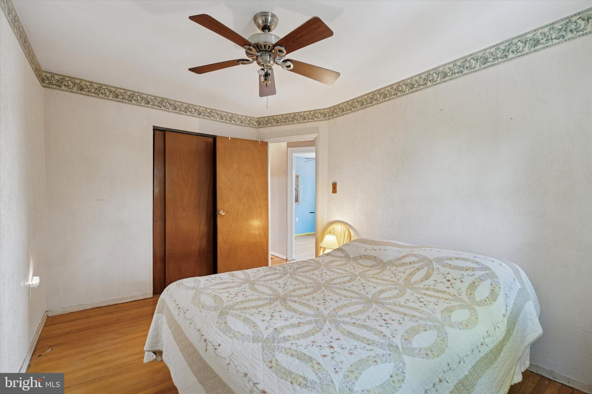 718 Cherry Street Lansdale, PA 19446 - Photo 17 of 23 a bedroom with a bed and a chandelier