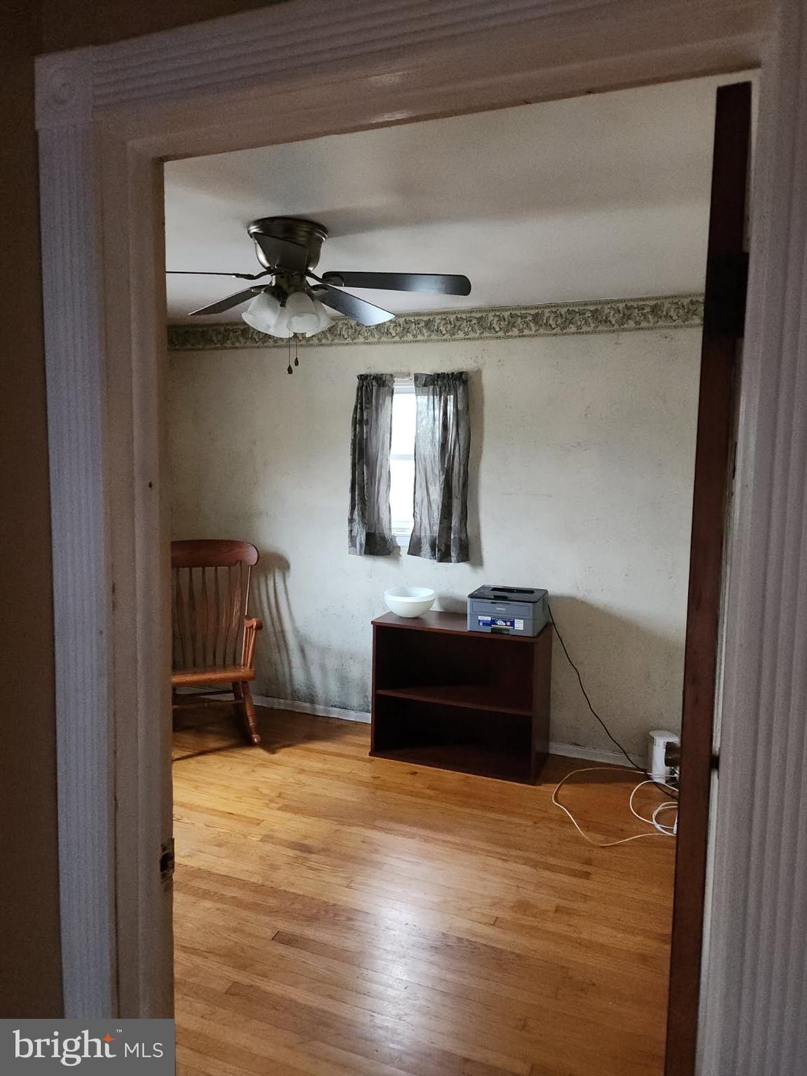 718 Cherry Street Lansdale, PA 19446 - Photo 18 of 23 a room with kitchen island and wooden floor