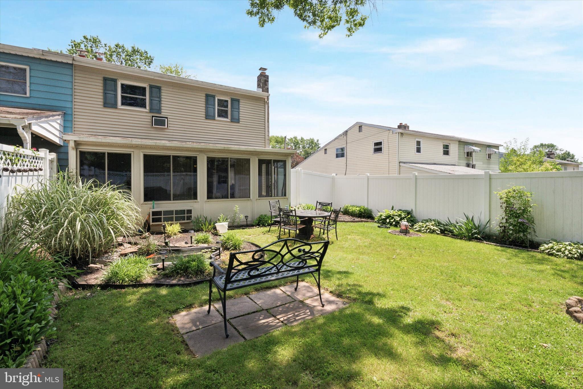718 Cherry Street Lansdale, PA 19446 - Photo 22 of 23 a view of a house with backyard sitting area and garden