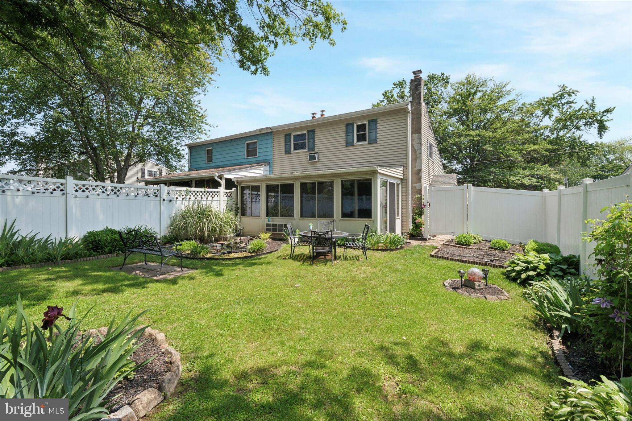 718 Cherry Street Lansdale, PA 19446 - Photo 23 of 23 a view of a house with backyard sitting area and garden