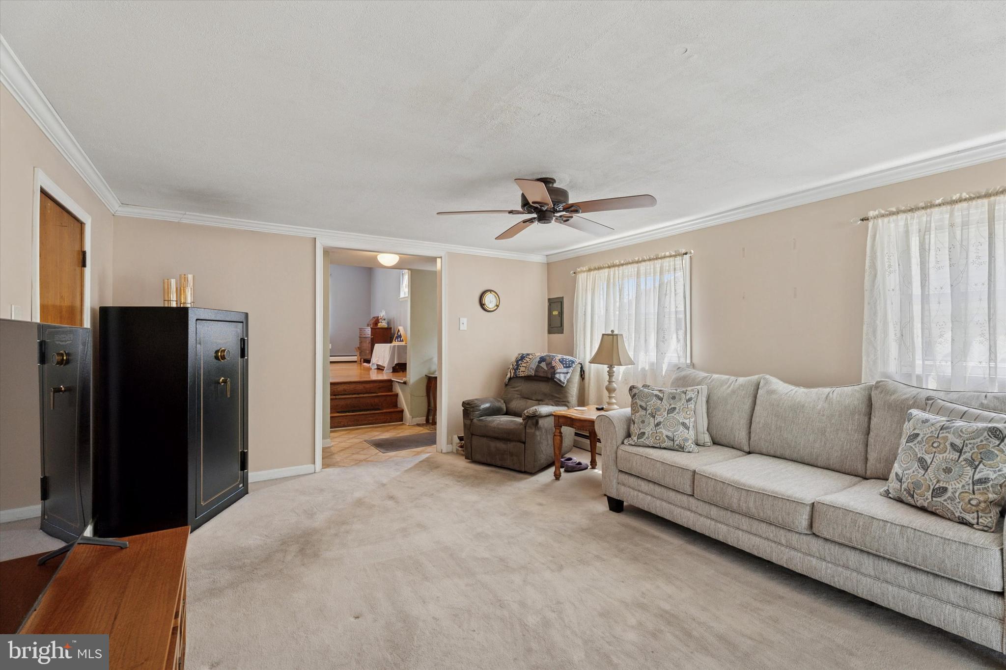 718 Cherry Street Lansdale, PA 19446 - Photo 6 of 23 a living room with furniture and a refrigerator