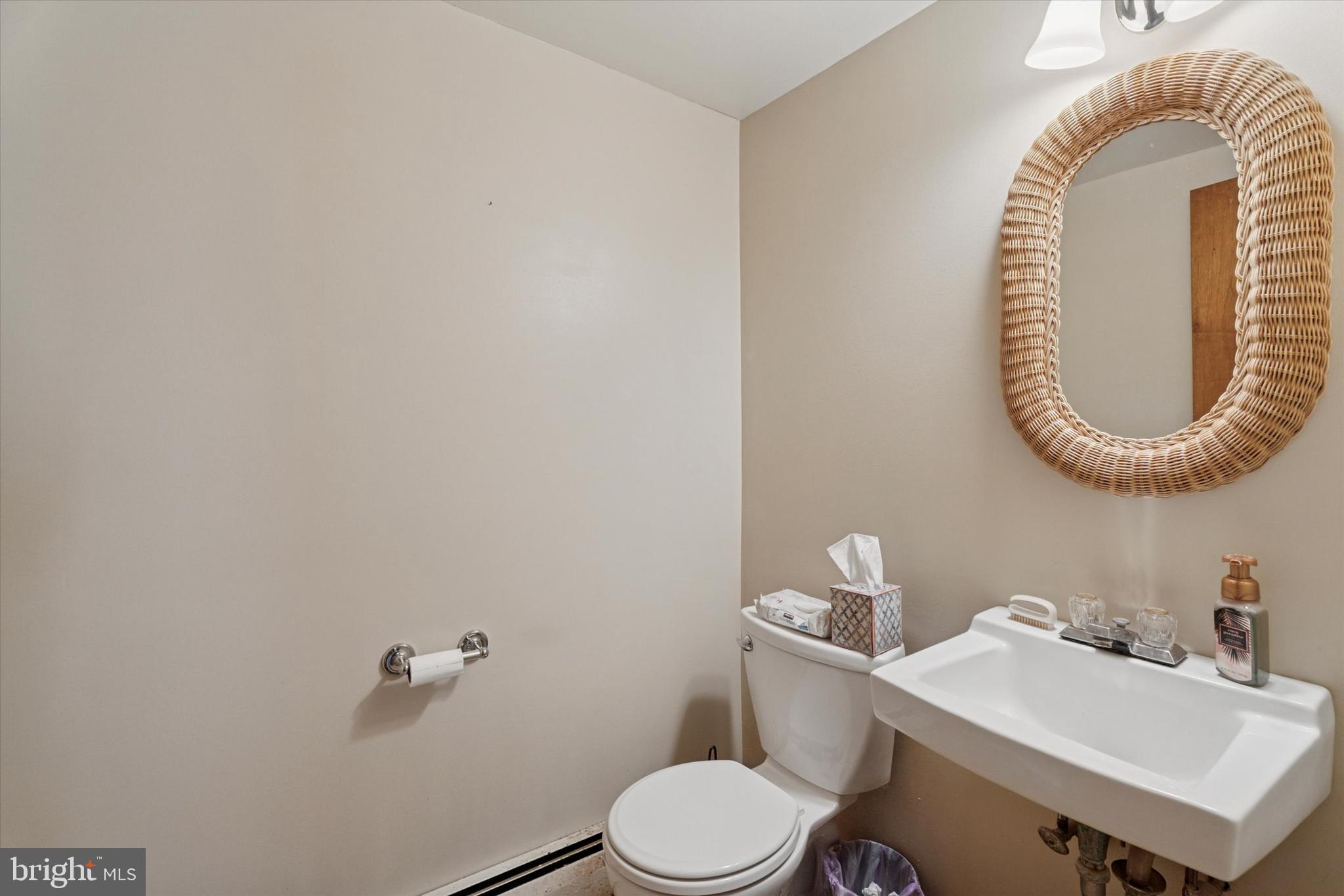 718 Cherry Street Lansdale, PA 19446 - Photo 8 of 23 a bathroom with a sink and a mirror