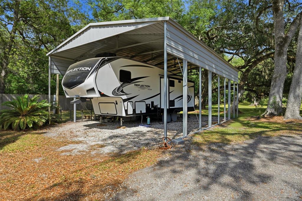 7037 County Road 625 Bushnell, FL 33513 - Photo 14 of 99 a view of a house with backyard and sitting area